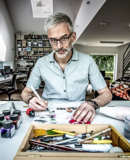 Comic Artist Nix at his drawing board